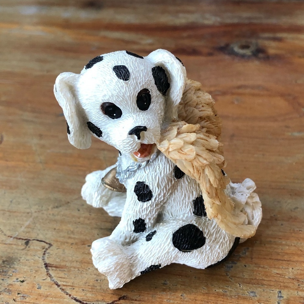 Playful Dalmatian Pup in Angel Wings Sitting & Smiling